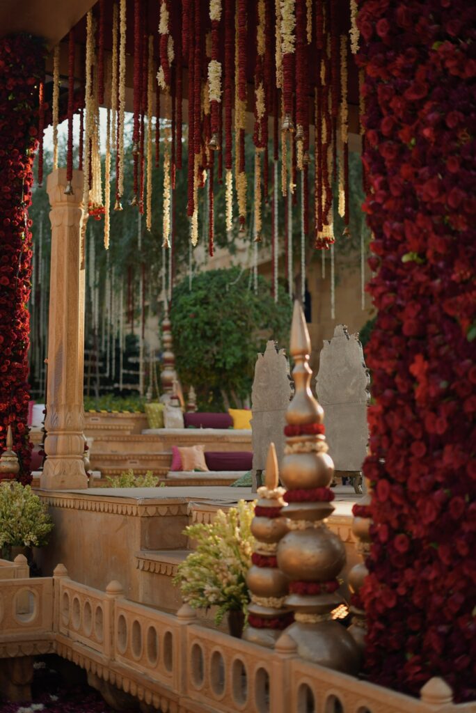 Draped fabric and luxury decorating the outdoor wedding ceremony space.